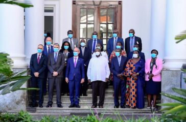 President Museveni in a group photo with the President of Total Energies and his delegation at SHE - 01