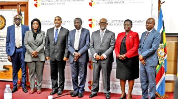 Minister of Finance Ho. Matia Kasaija with the new board for National Lotteries and Gaming Regulatory Board