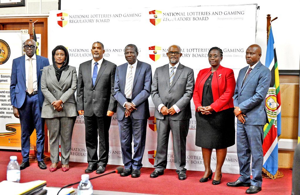 Minister of Finance Ho. Matia Kasaija with the new board for National Lotteries and Gaming Regulatory Board