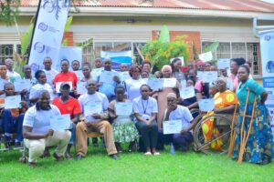 UCC and UCUSAF officials with some of the disabled beneficiaries of the digital skills programme UCC and UCUSAF officials with some of the disabled beneficiaries of the digital skills programme