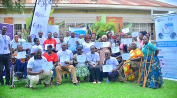 UCC and UCUSAF officials with some of the disabled beneficiaries of the digital skills programme