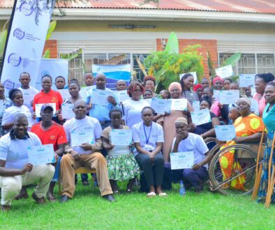 UCC and UCUSAF officials with some of the disabled beneficiaries of the digital skills programme