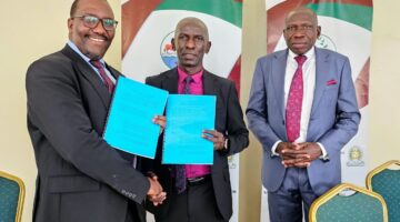 NARO-Director-General-Dr.-Yona-Baguma-center-exchanges-a-signed-license-with-the-Managing-Director-of-FICA-Seeds-Mr.-Narsis-Tushabe-after-the-signing-in-Kajjansi-1-2048x1510.jpg NEW