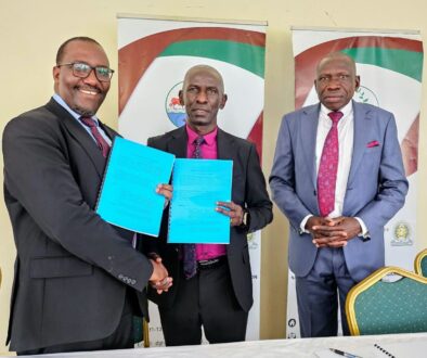NARO-Director-General-Dr.-Yona-Baguma-center-exchanges-a-signed-license-with-the-Managing-Director-of-FICA-Seeds-Mr.-Narsis-Tushabe-after-the-signing-in-Kajjansi-1-2048x1510.jpg NEW
